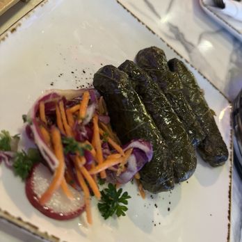 Aleppo's Kitchen - MAMA SUHER'S YALANJI $13 (Stuffed Grape Leaves) stuffed with rice, parsley, and onion, in extra virgin olive oil. - Mediterranean Near Me - Anaheim, California