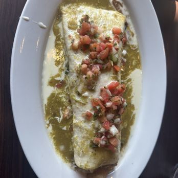Teresa's - Fiesta Burrito - Carnitas, beans, rice, onions. cheese sauce and pico on top. i had them add the salsa verde, it was excellent. - Mexican Near Me - Lakeville, Minnesota