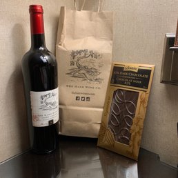 a bottle of wine and a bag of chocolate