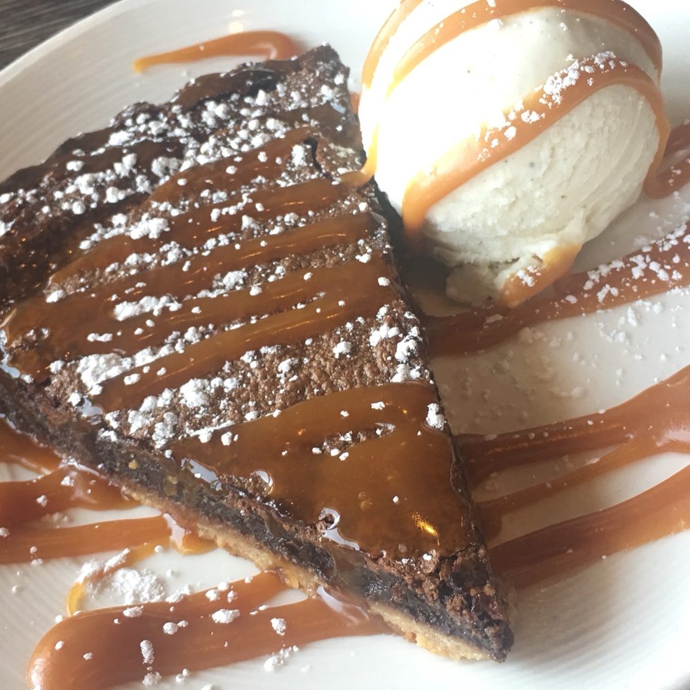 High Tide - Bourbon Chocolate Tart $8 with a scoop of vanilla ice cream... Worth it!!! Made in house by chef! Will order again! Good to share! - Seafood Near Me - Gilbert, Arizona High Tide - Bourbon Chocolate Tart $8 with a scoop of vanilla ice cream... Worth it!!! Made in house by chef! Will order again! Good to share! - Seafood Near Me - Gilbert, Arizona
