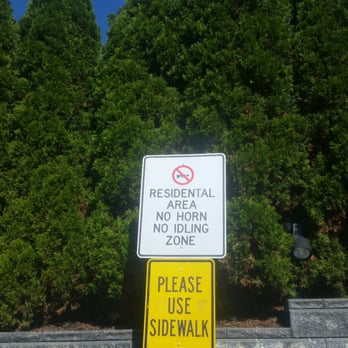 Valero - a no parking sign on a sidewalk - Gas Stations Near Me - Mahwah, New Jersey