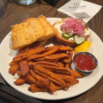 Burtons Grill & Bar - Fried Fish sandwich with sweet potato fries - New American Near Me - Plantation, Florida Burtons Grill & Bar - Fried Fish sandwich with sweet potato fries - New American Near Me - Plantation, Florida