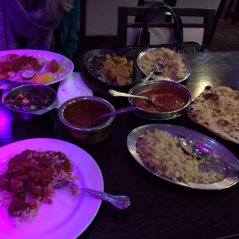 Sag paneer, lamb tikka masala, tandoori chicken, garlic rice, and fresh nan. Delicious.
