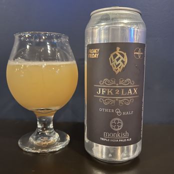 Beer Run - a glass of beer next to a can - Beer, Wine & Spirits Near Me - New York, New York