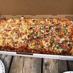 Sapranos Pizza - The half and half gang size pizza. SO TASTY!