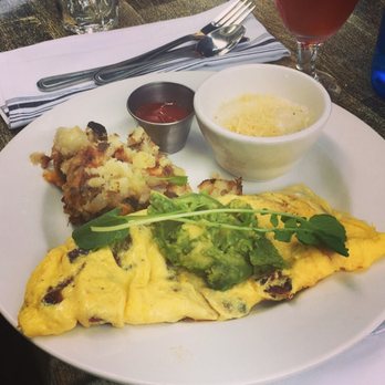 Cody's La Jolla - Bacon and Cheddar Onmlette (and a little bit of both the grits and potatoes). - Breakfast & Brunch Near Me - La Jolla, California Cody's La Jolla - Bacon and Cheddar Onmlette (and a little bit of both the grits and potatoes). - Breakfast & Brunch Near Me - La Jolla, California