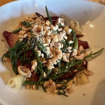 Feast - Stonefruit and samphire: Today's stonefruit (a plum) with sea beans, pickled ginger and hazelnuts - New American Near Me - Tucson, Arizona