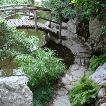 Adan Landscaping - a bridge over a small pond - Landscaping Near Me - New Castle, Delaware