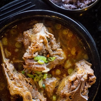 Piggy's Island - Ttuk Bae Gi Gam Ja Tang A thick soup made of pork backbones, potatoes, cabbage leaves, crushed perilla seeds, perilla leaves and garlic. - Korean Near Me - Thornhill, Ontario