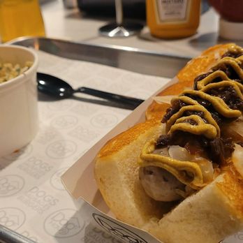 Dog Haus - a hot dog with mustard and ketchup - Burgers Near Me - Franklin, Wisconsin