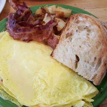 Tuckers - House hash and cheese omelet with red potato home fries and sourdough toast. I added a side order of bacon. All were fantastic! - Breakfast & Brunch Near Me - Hooksett, New Hampshire