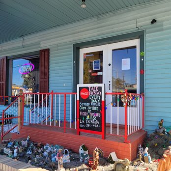 La Patrona - the front porch of a house decorated for christmas - Mexican Near Me - New Orleans, Louisiana