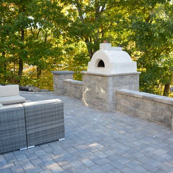 Stefano's Landscaping - a patio with a fireplace - Landscaping Near Me - Saugus, Massachusetts