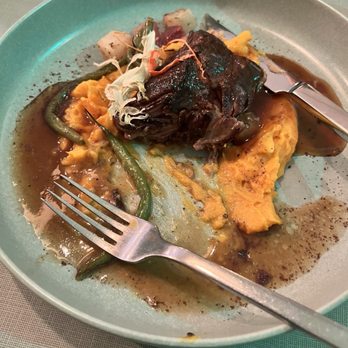 The Strand - Spare Rib on top of a curry carrott mash - New American Near Me - Orlando, Florida The Strand - Spare Rib on top of a curry carrott mash - New American Near Me - Orlando, Florida