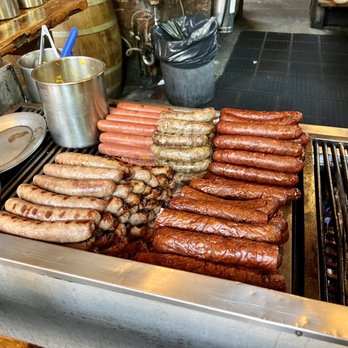 Radegast Hall and Biergarten - a variety of sausages on a grill - Pubs Near Me - Brooklyn, New York Radegast Hall and Biergarten - a variety of sausages on a grill - Pubs Near Me - Brooklyn, New York