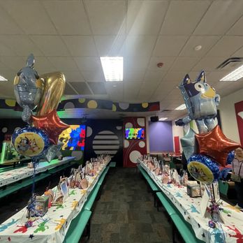 Chuck E Cheese's - a long table with balloons - Pizza Near Me - Carson, California