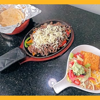 Latin Flavor - a skillet of food and a plate of tortillas - Mexican Near Me - Provo, Utah Latin Flavor - a skillet of food and a plate of tortillas - Mexican Near Me - Provo, Utah