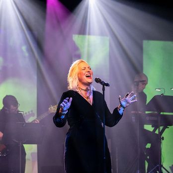 Prima - a woman in a black dress singing on stage - Performing Arts Near Me - Lancaster, Pennsylvania