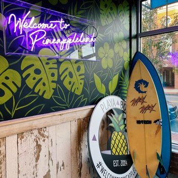 Playa Bowls - two surfboards in front of a neon sign - Juice Bars & Smoothies Near Me - Darien, Connecticut Playa Bowls - two surfboards in front of a neon sign - Juice Bars & Smoothies Near Me - Darien, Connecticut