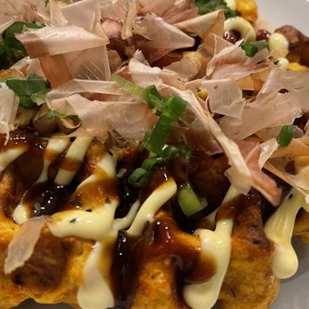 Anytime Kitchen  - Kimchi Okonomiyaki- waving squid flakes and all.  Kimchi flavor was mild.  Nice dish. - Korean Near Me - New York, New York