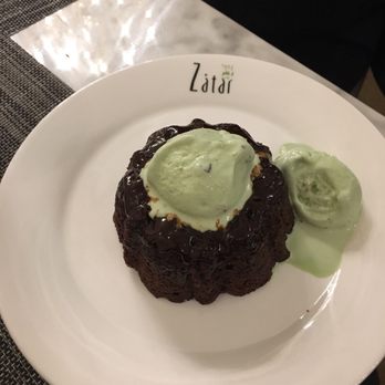 Zatar - Yummy warm chocolate bundt cake with pistachio ice cream - Lebanese Near Me - Dallas, Texas Zatar - Yummy warm chocolate bundt cake with pistachio ice cream - Lebanese Near Me - Dallas, Texas
