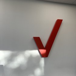 Verizon - Verizon logo inside by the benches