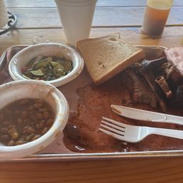Brisket Plate with cucumber salad and baked beans. Yummy Brisket Plate with cucumber salad and baked beans. Yummy