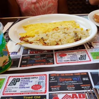 Country House Restaurant - a woman sitting at a table with a plate of food - Diners Near Me - Thorofare, New Jersey