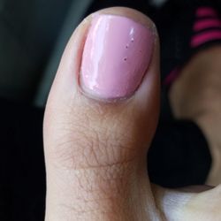 L & S Lucky Nail Spa - Like wtf is this? Terrible work... It looks awful. And this is after I removed the Polish running to the edge on the right side....