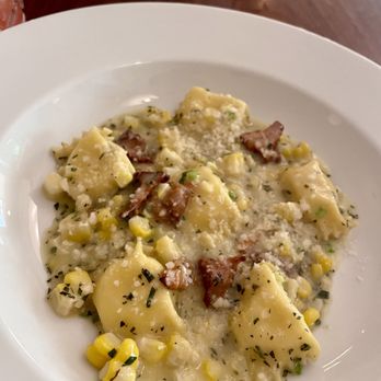 Persimmon - Agnolotti with potato and fontina cheese, corn and chanterelles - New American Near Me - Providence, Rhode Island