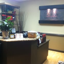 Satin Med Spa - Satin's front desk area with a relaxing water fountain