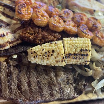 La Ilusion Al Carbon - Up and close mini carbonado: shrimp, flank, rib eye, chicken, short ribs, beans, rice... all for $34  $8 for shrimp addition. - Mexican Near Me - Tacoma, Washington
