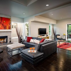 Capstone Custom Builders - cozy living room, gas fireplace, dark wood floor, open concept, pella windows