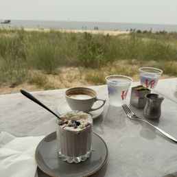 Yogurt parfait and capuchino. Yogurt parfait and capuchino.