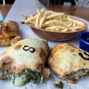 La Masa Empanada Bar - La Masa Trio Cheese Curd and Bacon Empanada Spinach and Cheese Empanada Carnitas verde Empanada Basket of Thin N Crispy Fries - Empanadas Near Me - Milwaukee, Wisconsin La Masa Empanada Bar - La Masa Trio Cheese Curd and Bacon Empanada Spinach and Cheese Empanada Carnitas verde Empanada Basket of Thin N Crispy Fries - Empanadas Near Me - Milwaukee, Wisconsin
