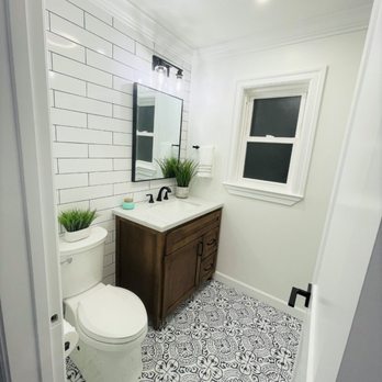 JV Services - a bathroom with a toilet and sink - General Contractors Near Me JV Services - a bathroom with a toilet and sink - General Contractors Near Me