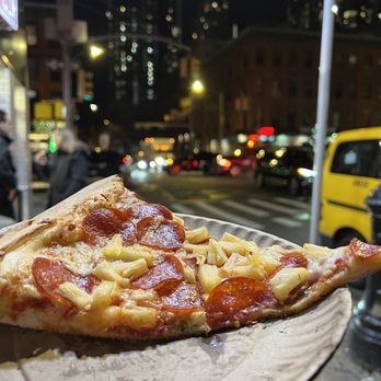 2 Bros Pizza - a slice of pizza on a paper plate - Pizza Near Me - New York, New York 2 Bros Pizza - a slice of pizza on a paper plate - Pizza Near Me - New York, New York