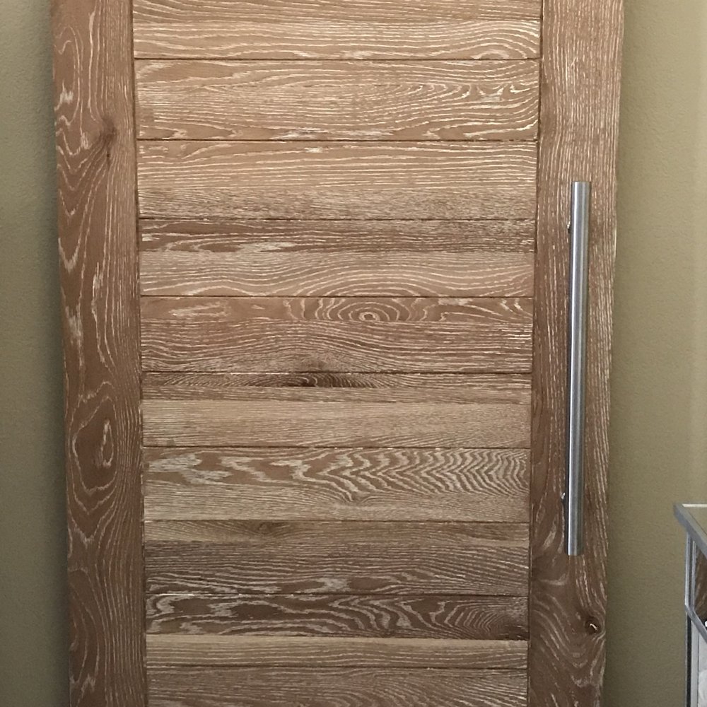 Beautiful solid barn door with modern aluminum handle. Beautiful solid barn door with modern aluminum handle.