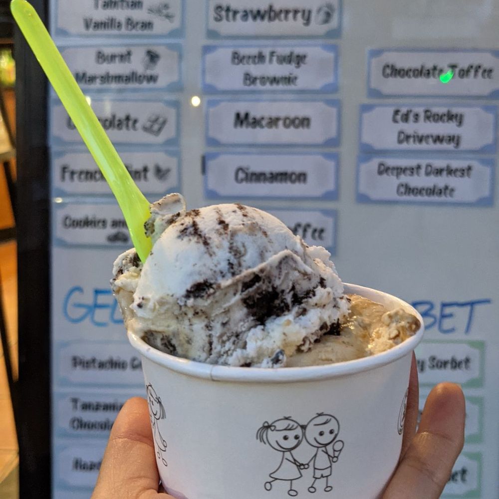 Ed's Real Scoop - a hand holding a cup of ice cream - Ice Cream & Frozen Yogurt Near Me - Toronto, Ontario