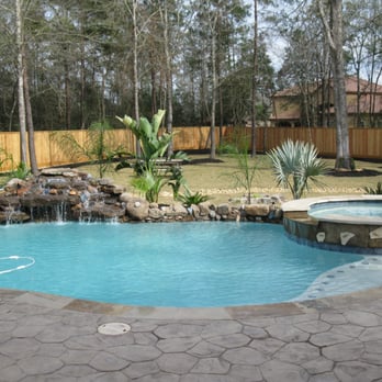 Pools by Design - a pool with a waterfall - General Contractors Near Me - The Woodlands, Texas Pools by Design - a pool with a waterfall - General Contractors Near Me - The Woodlands, Texas