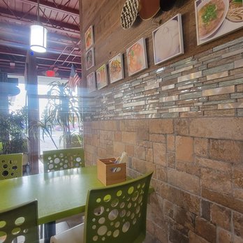 Mekong Pho - a table and chairs in a restaurant - Thai Near Me - Anchorage, Alaska