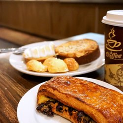 La Gourmandine Bakery - La Gourmandise: flaky buttery pastry filled with vanilla cream and chocolate drops ($3.60).