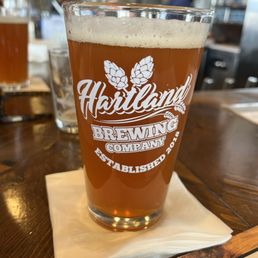 a pint of beer on a napkin