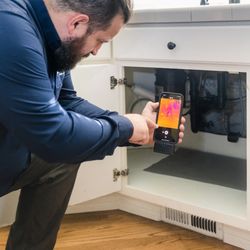 Pillar To Post - The Jarquin Team - Using infrared technology to detect hidden issues around the sink--like leaks, moisture buildup, or plumbing concerns.