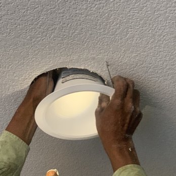Omega Electrical Inc - Michael in the process of fixing the issue. (The light turned off while he was working, bad photo on my part). - Electricians Near Me