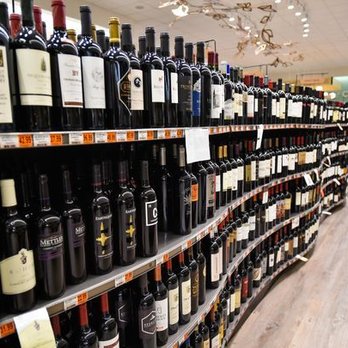Champagne's Market - rows of wine bottles on shelves - Grocery Near Me - Lafayette, Louisiana Champagne's Market - rows of wine bottles on shelves - Grocery Near Me - Lafayette, Louisiana