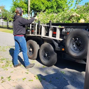 Exalt Outdoor Services - Loading the dump trailer - Landscaping Near Me - Saint Cloud, Florida