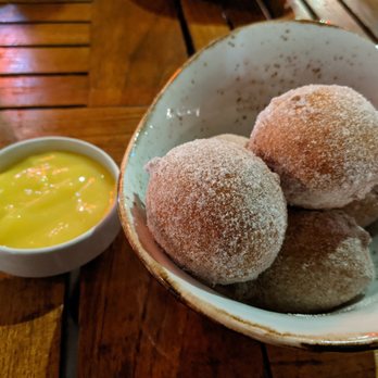 The Table - Marvelous Sugar-Dusted Ricotta Beignets served with smooth and silky lemon curd, dessert perfection. Almost ordered again immediately. - New American Near Me - San Jose, California The Table - Marvelous Sugar-Dusted Ricotta Beignets served with smooth and silky lemon curd, dessert perfection. Almost ordered again immediately. - New American Near Me - San Jose, California