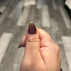Euphoria Nails Lounge - Slanted nail- but sure go ahead and charge to shape