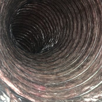 Aura Home Experts - Ducts photo with my cell phone camera Flash After they ran their system through it This is before they put the covers back on - Air Duct Cleaning Near Me - Dallas, Texas